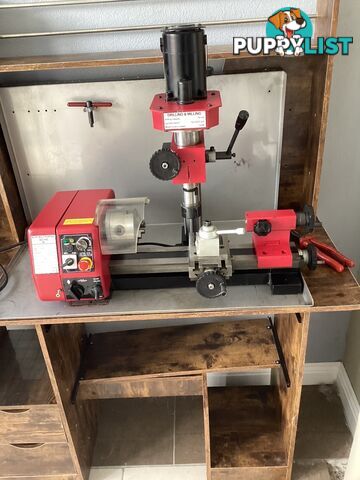 bench lathe with 3 jaw chuck and vertical milling attatchment.